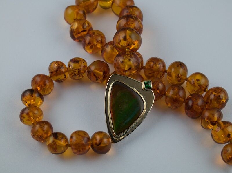 Ammolite and Amber set in gold with Tzavorite Garnet