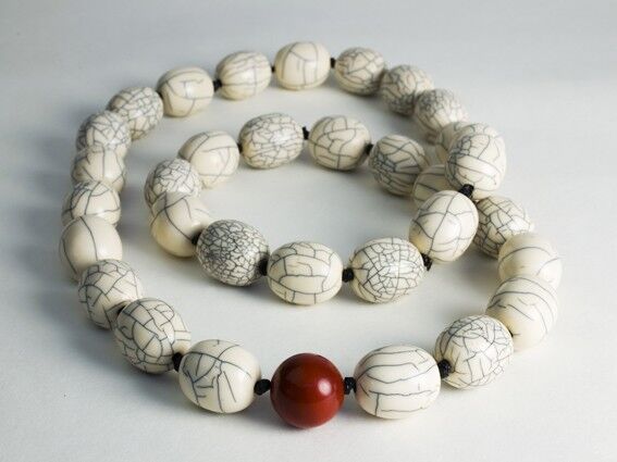 Oval bone beads and one Jasper bead.