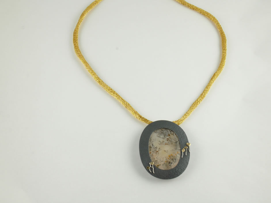 Dendritic Quartz pendant framed by oxidized Silver with Gold details