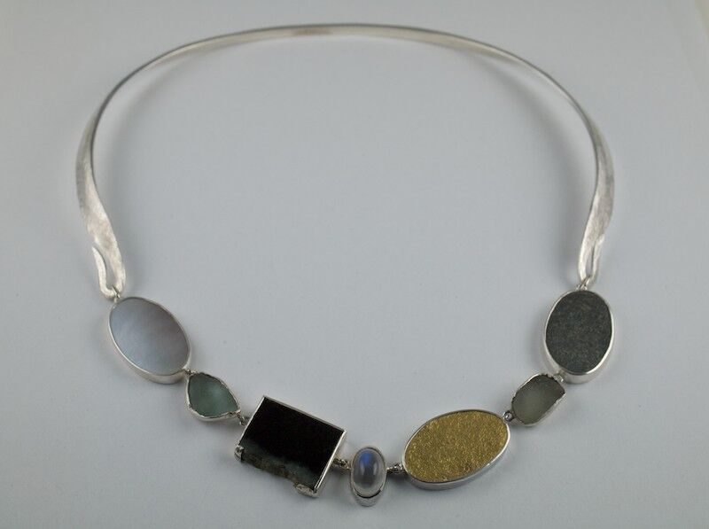 Found pebbles,jade, moonstone and gold set in silver forged Necklace