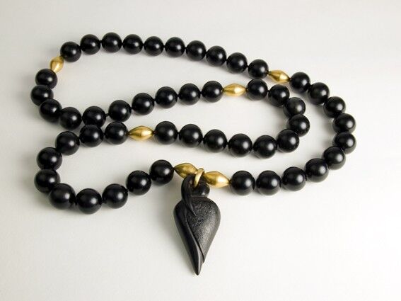 Rosebud carved in Jet with 22 carat gold beads as spacers in the jet beads