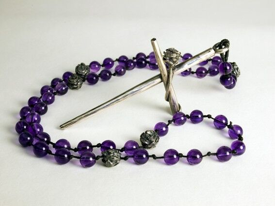 Amethyst beads with Roses as the "our Fathers" holding a Silver Crucifix