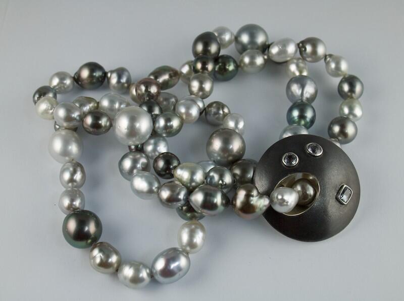 Pearls with silver disc set with Sapphires